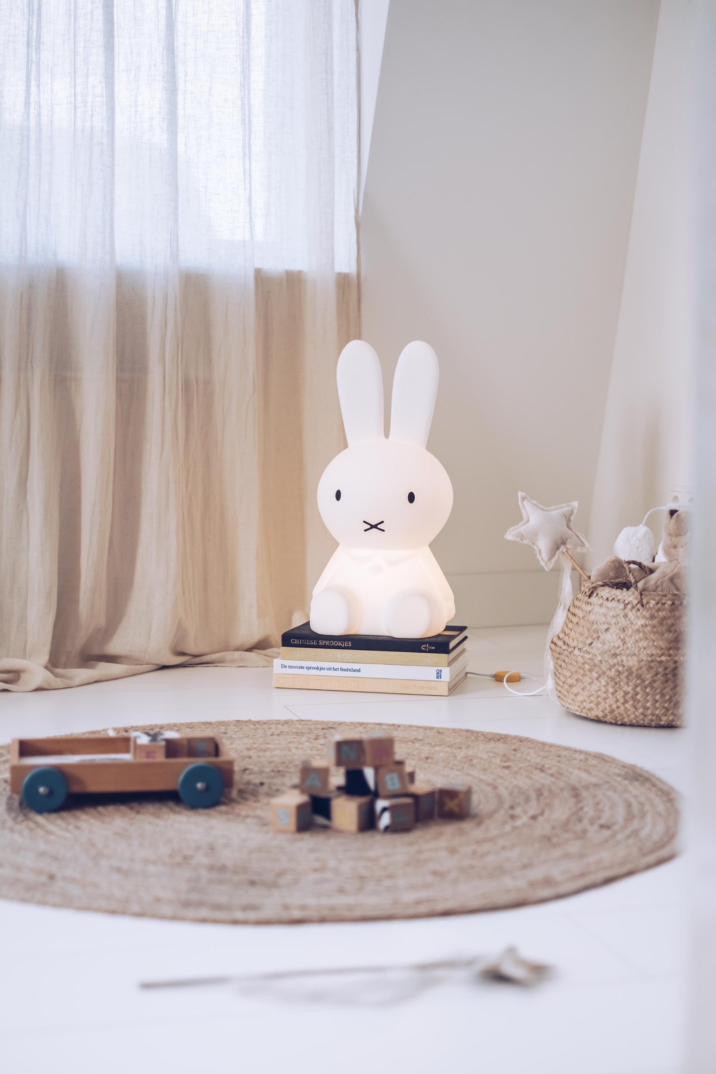 Lifestyle photo of Miffy Star Light in a living room corner