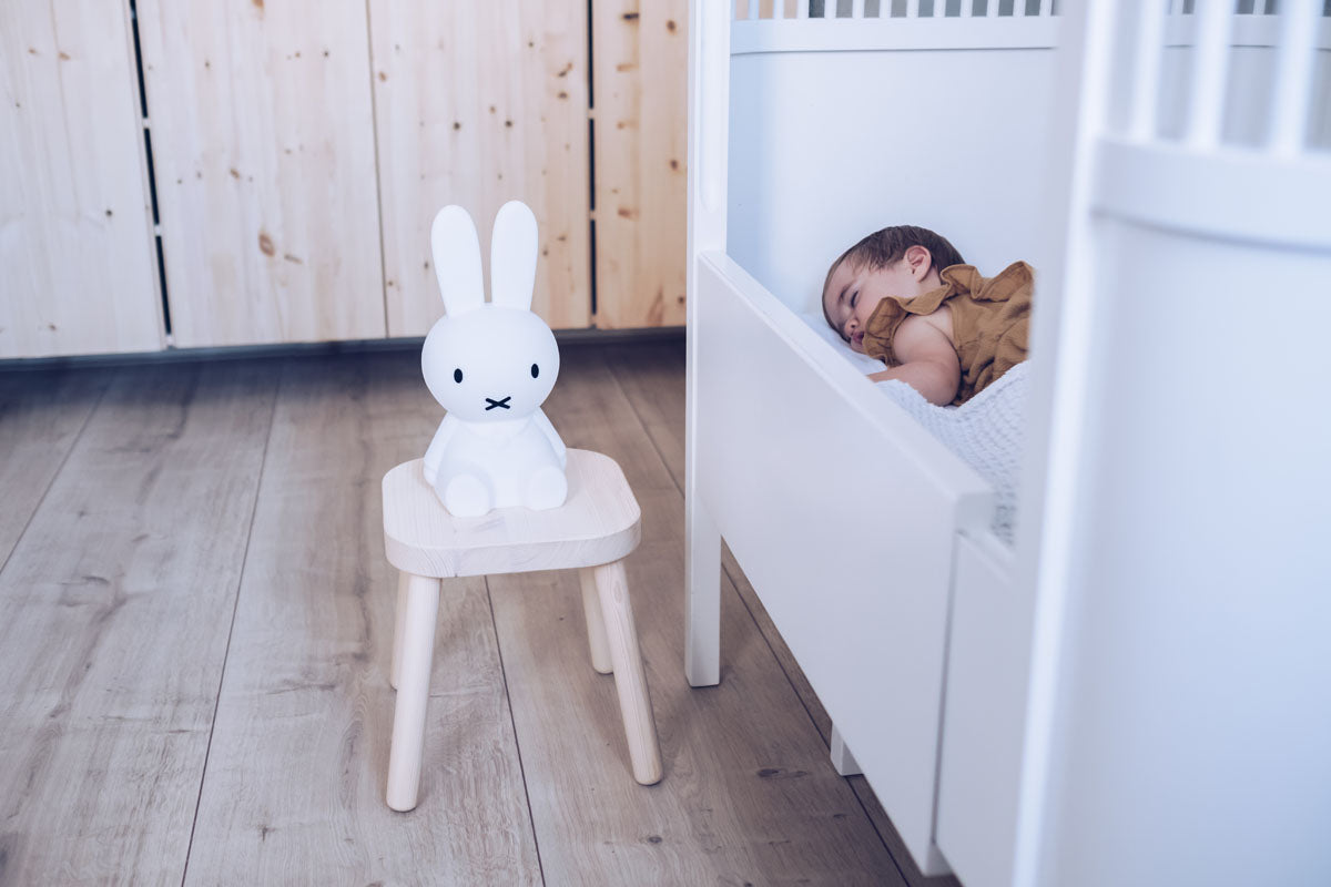 Miffy First Light wireless night lamp sitting in the nursery room
