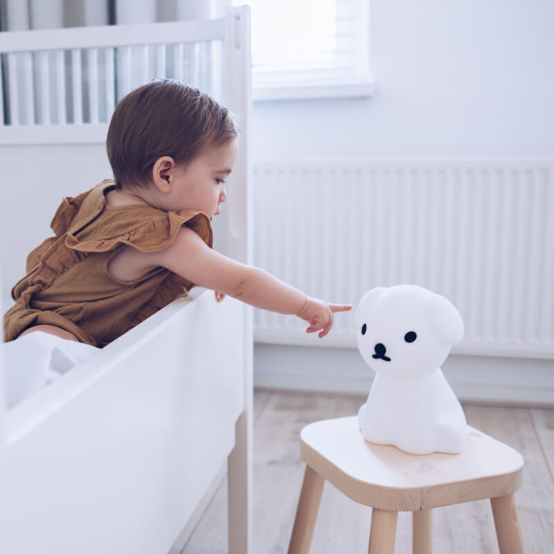 Snuffy First Light wireless lamp placed on a bedside table