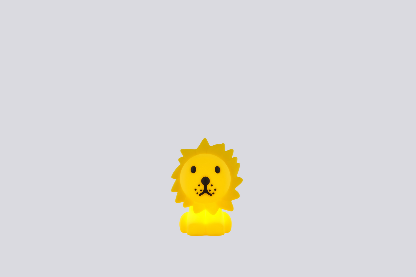 Yellow lion-shaped lamp on a light gray background