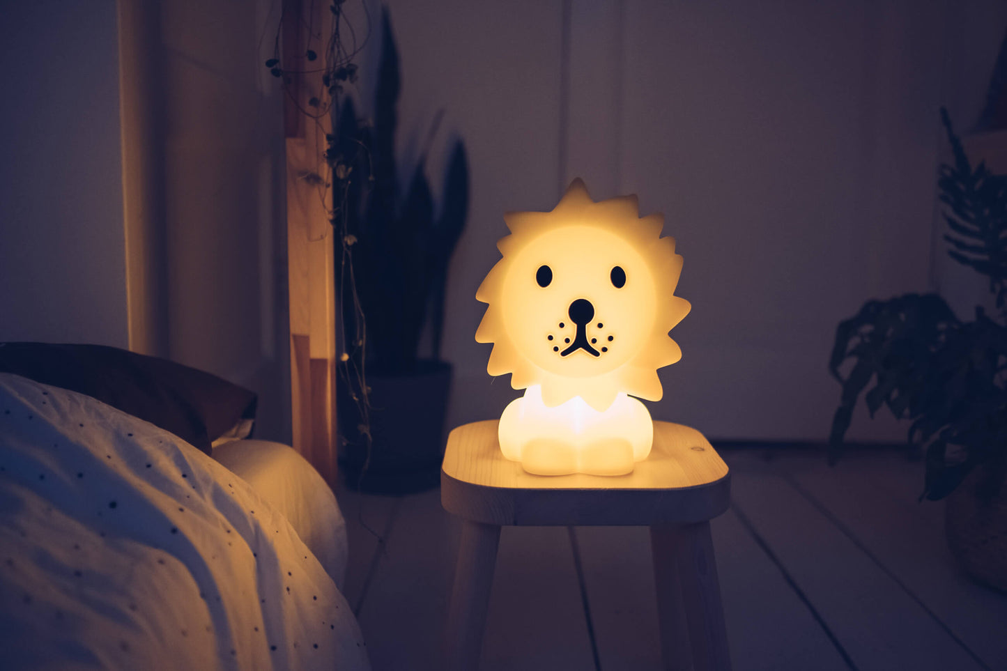 Lion First Light LED lamp showing adjustable brightness in a cozy room
