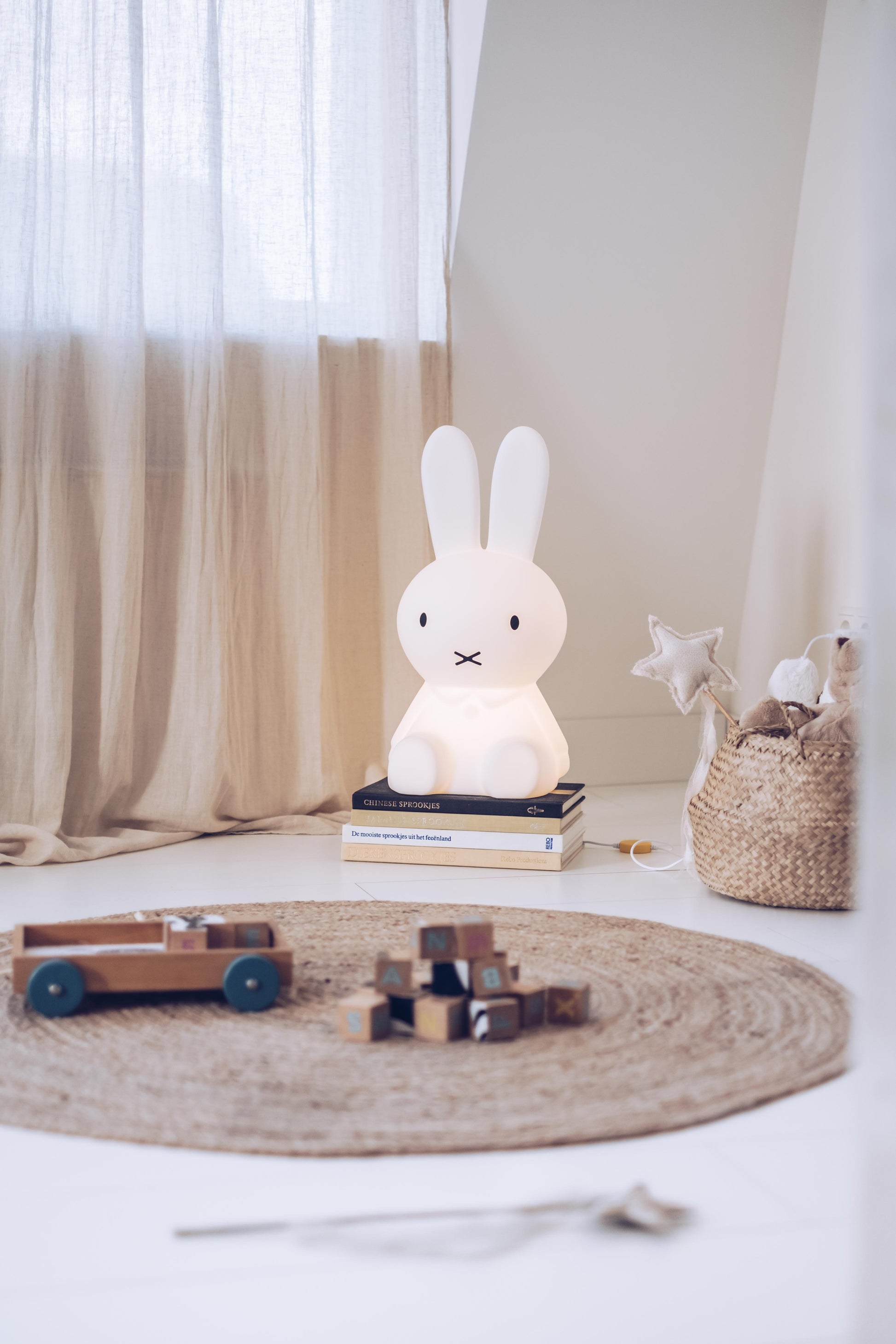 Lifestyle photo of Miffy Star Light in a living room corner