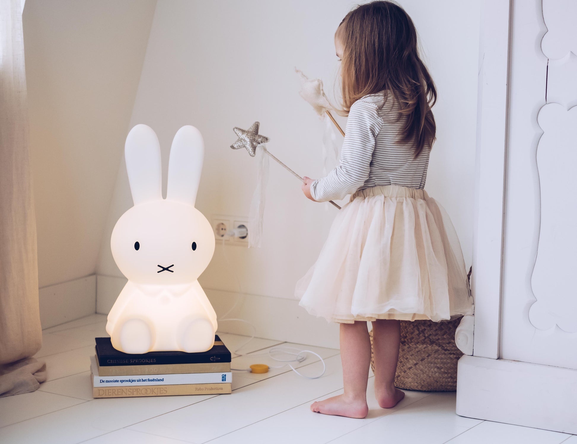 Miffy Star Light placed next to books and toys in a children’s room