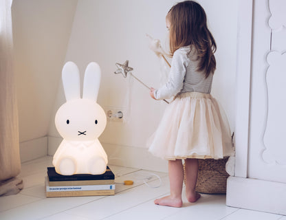 Miffy Star Light placed next to books and toys in a children’s room