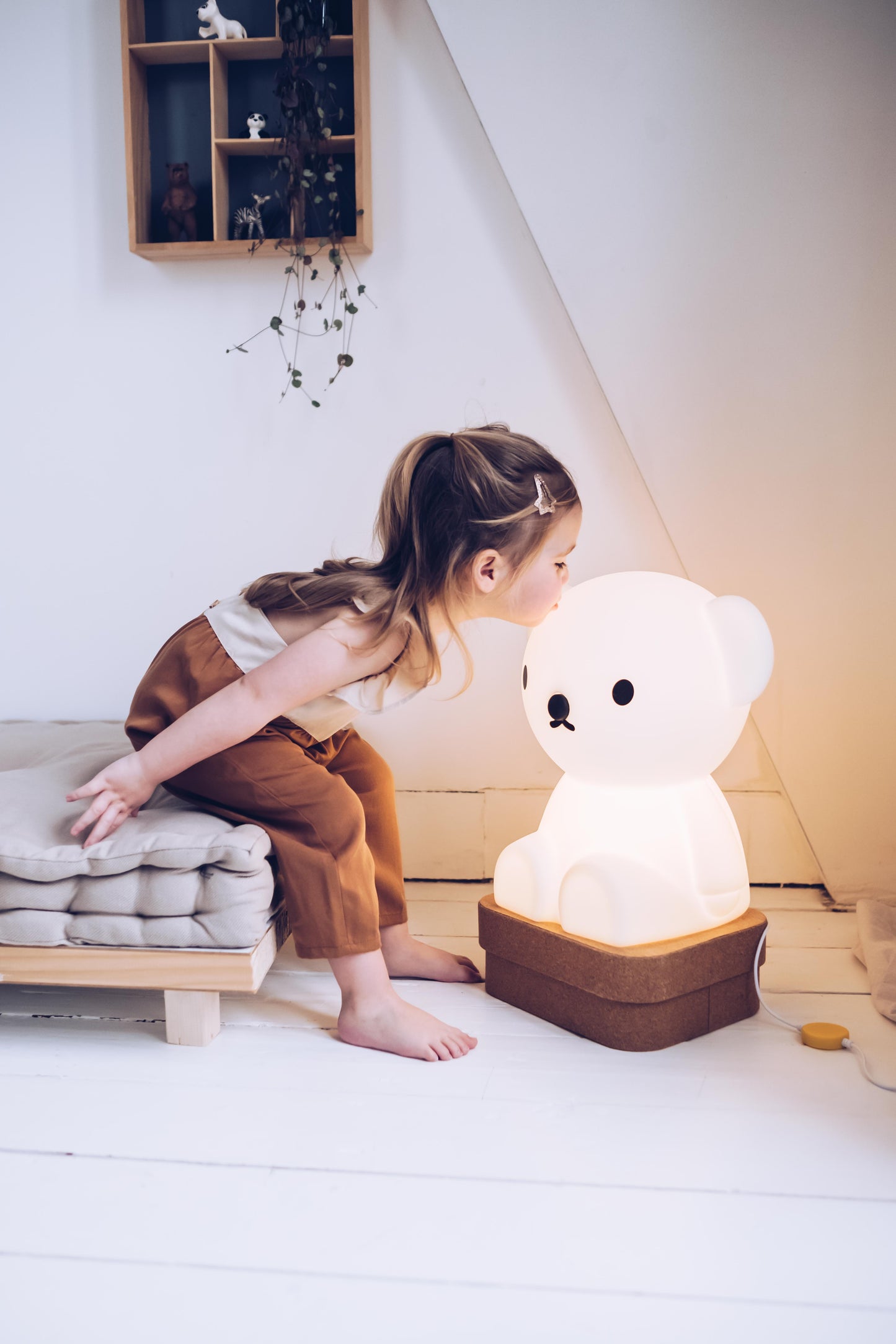 Lifestyle photo of Boris Star Light lamp in a cozy living room corner