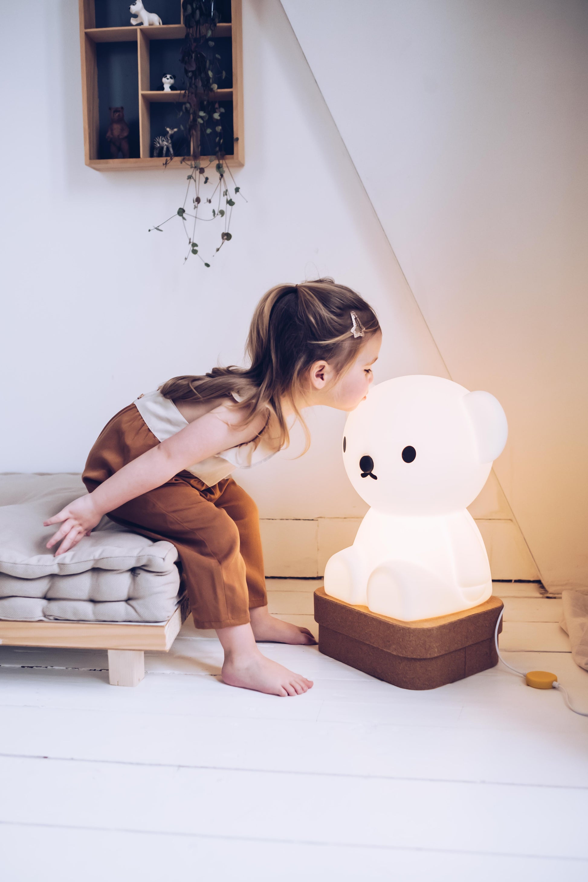 Lifestyle photo of Boris Star Light lamp in a cozy living room corner