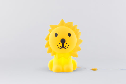 Yellow lion-shaped toy on a light gray background