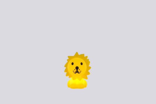 Yellow lion-shaped lamp on a light gray background