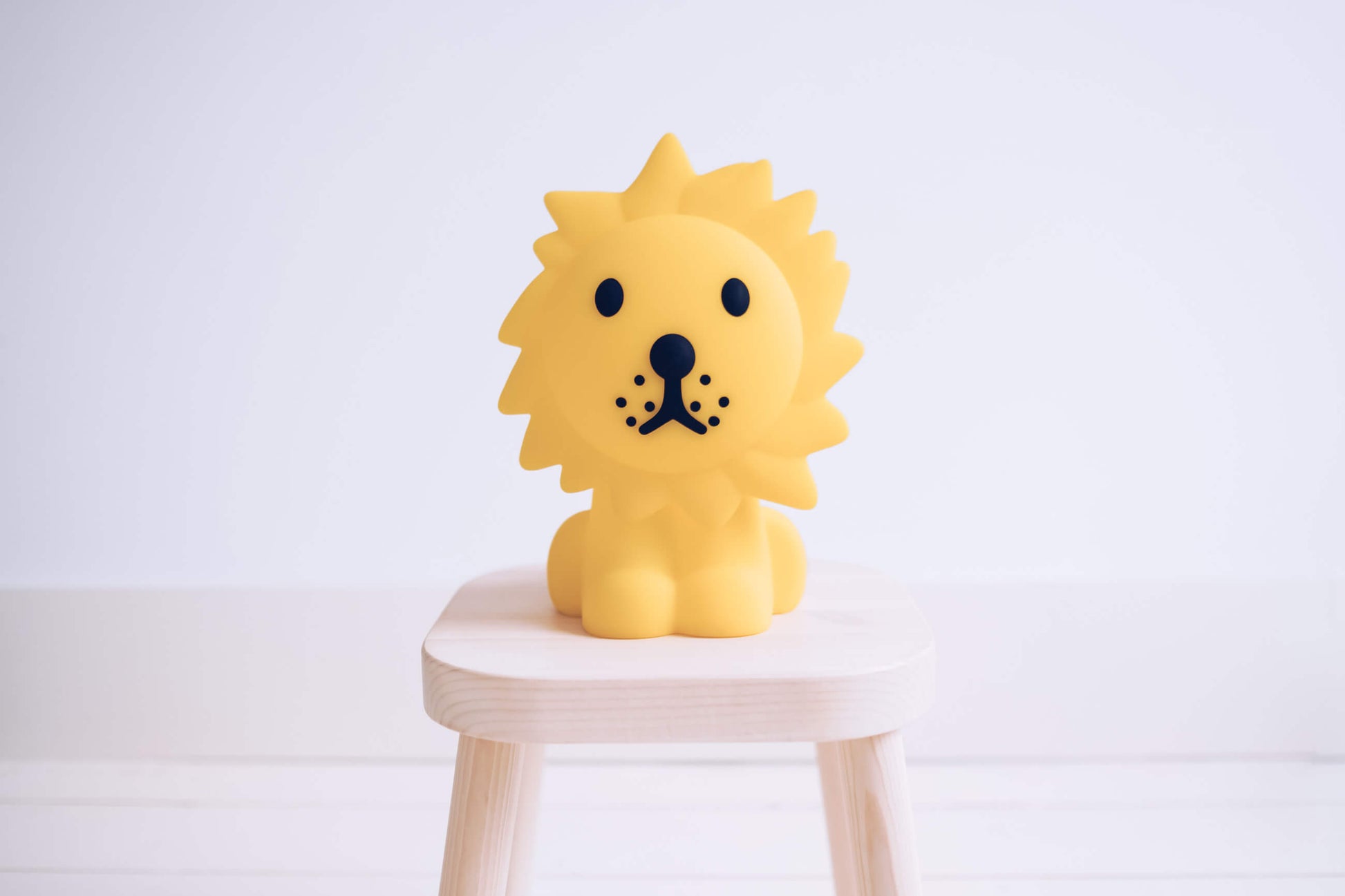 Lion First Light being recharged with yellow USB cable