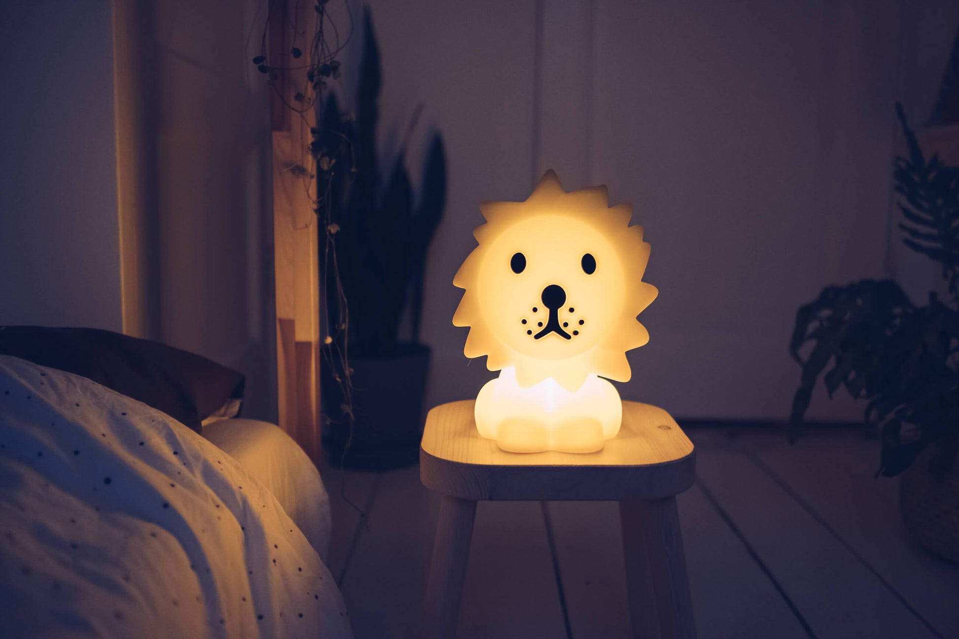 Lion First Light LED lamp showing adjustable brightness in a cozy room